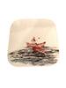 Assiette en porcelaine canoë sur lac