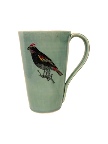 tasse en porcelaine bleu avec oiseau